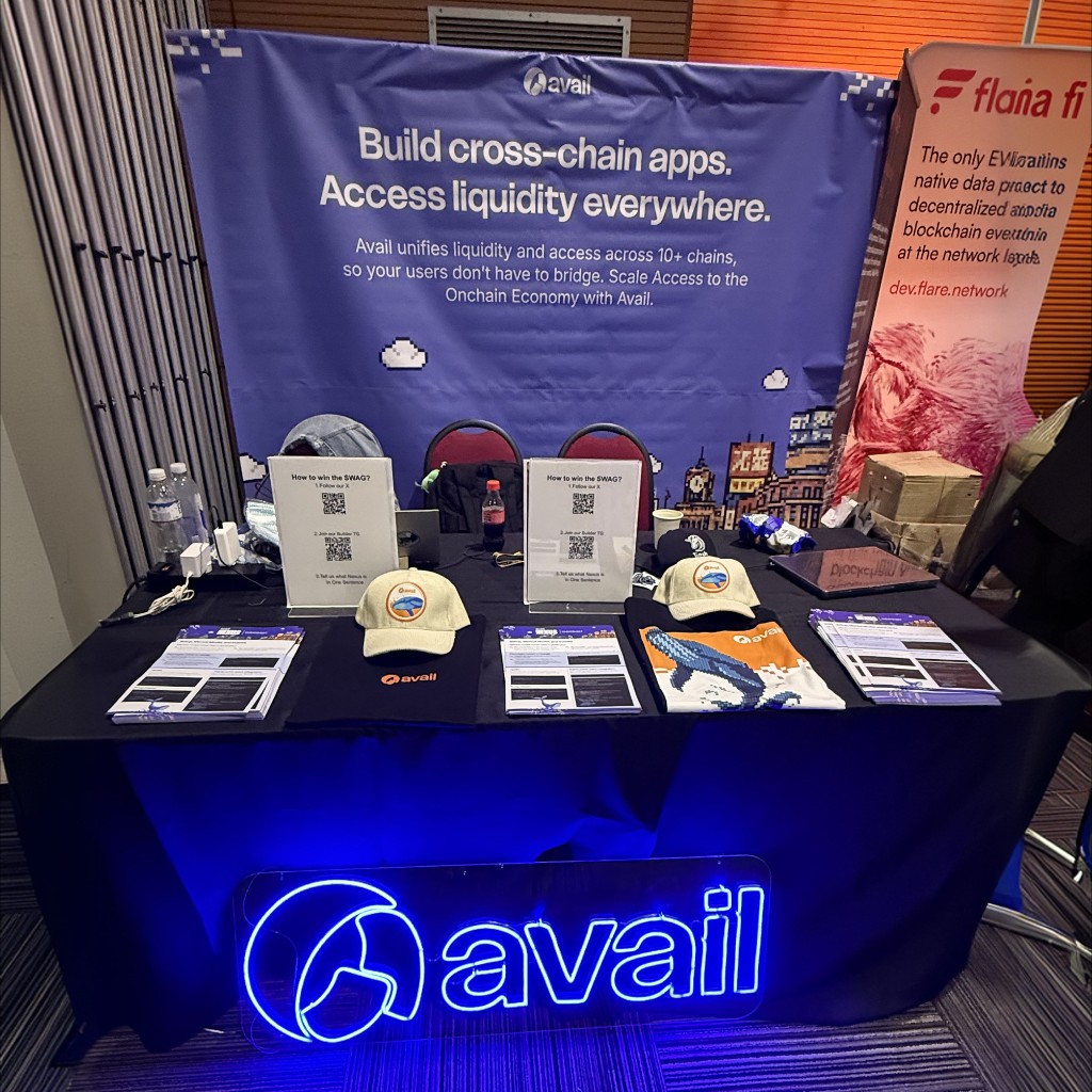 Avail booth at a blockchain conference with branded signage
